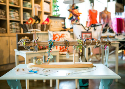 Beaded jewelry displayed on driftwood jewelry stand.
