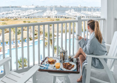 view from guest room overlooking pool at charleston harbor resort and marina.
